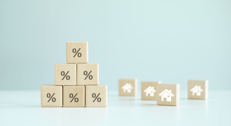 A stack of wooden blocks with percent symbolsAI-generated content may be incorrect.