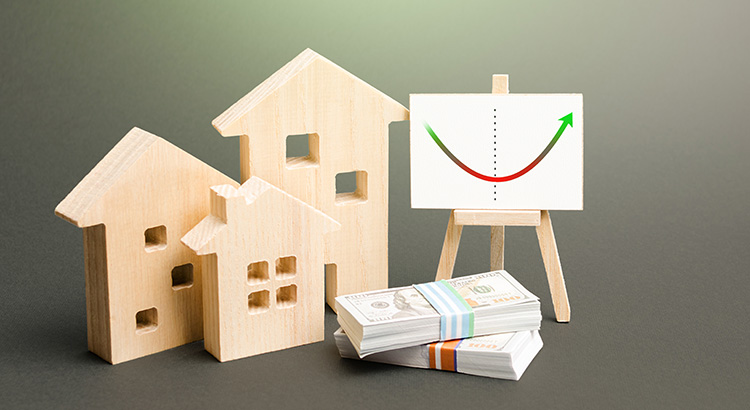 A wooden houses and a sign with a graph on itDescription automatically generated with medium confidence